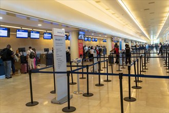 American Airlines airline check-in bag drop area inside Cancun airport