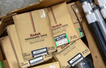 Old Kodak photographic paper packages on display in auction room