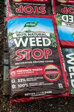Bags of Weed Stop decorative ground cover on sale in garden centre
