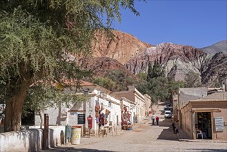 Street with souvenir shops in the village Purmamarca at the foot of Cerro de los Siete Colores