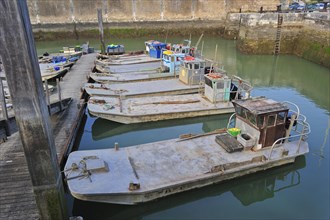 Flat-bottomed oyster farming boats in the harbour at Le Chateau-d'Oleron on the island Ile d'Oleron