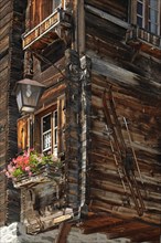 Housefront of traditional wooden house decorated with old skis in the Alpine village Grimentz
