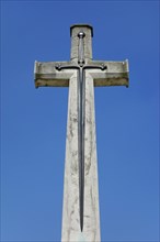 Cross of Sacrifice at military cemetery of the Commonwealth War Graves Commission burial ground for First World War One British soldiers in West Flanders