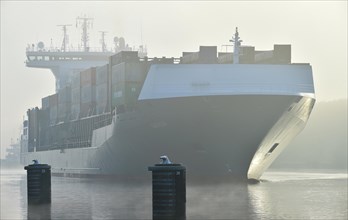 Container ship in fog in the Kiel Canal