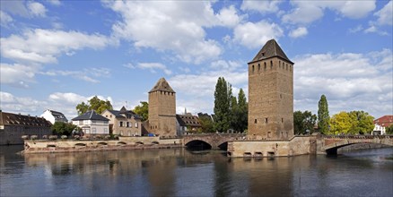 Tower of the medieval bridge Ponts Couverts over the river Ill in the Petite France quarter of city Strasbourg