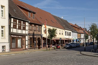 Half-timbered houses and shops in the cobbled Muehlenstrasse Am Markt in Seehausen