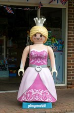 Giant Playmobil princess or queen model outside toy shop