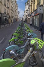 Urban rental bikes available in a street