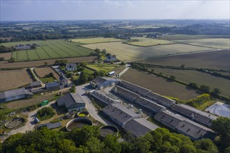 Aerial view of pig farm with closed stables and manure reservoirs