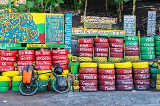 Wall of car tyres in the colours of Grenada on Happy Hill opposite Charlie's bar