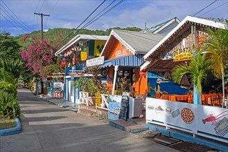 Main street with colourful shops and restaurants in capital town Port Elizabeth on the island Bequia