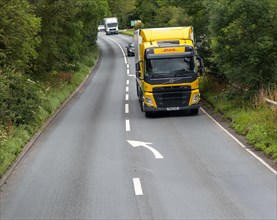 DHL truck lorry heavy goods delivery vehicle on A346 main road