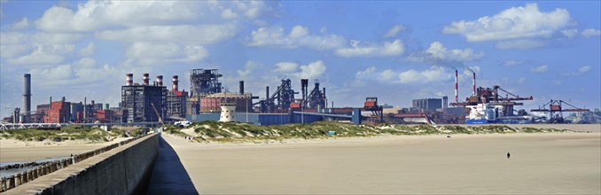 View over heavy industry seen from the beach at Dunkirk
