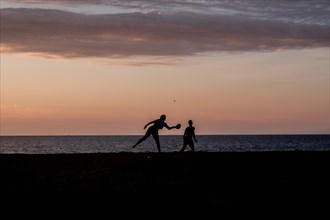 Ball players on the beach of the Mediterranean island of Corsica