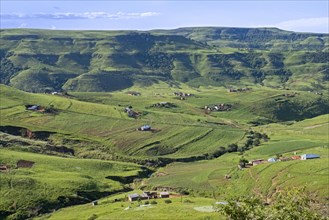 Drakensberg Mountain Range and rural settlement in the countryside of Injisuthi area in KwaZulu-Natal