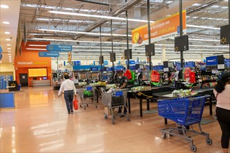 Goods and produce on display inside Walmart superstore shop store