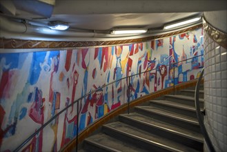 Staircase in the Metro station Abbesses decorated with an abstract painting