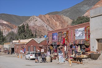 Street with souvenir shops in the village Purmamarca at the foot of Cerro de los Siete Colores