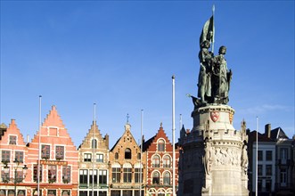 Statue of Jan Breydel and Pieter De Coninck and colourful facades at the Market place