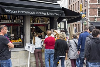 Tourists waiting in queue for Belgian homemade waffles and ice cream