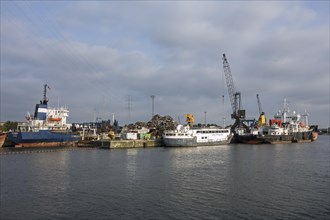 Old ships being dismantled to recycle scrap metal at Van Heyghen Recycling export terminal