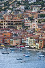 Sailing boats and colourful houses in the city Nice along the French Riviera