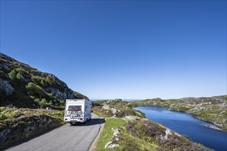A motorhome drives along the single track road and scenic route B869