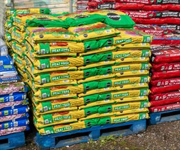 Bags of MiracleGro peat free compost on sale in garden centre
