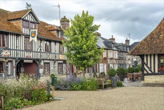 Half-timbered houses and cafes in one of the most beautiful villages in France Beuvron-en-Auge