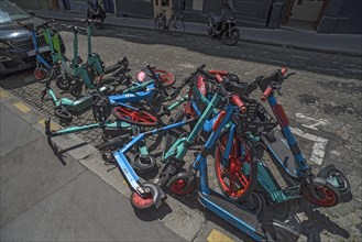 E-scooters thrown on the pile on the street