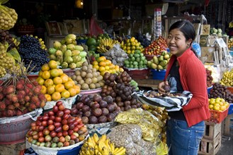Exotic fruit market with laughing vendor
