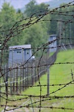 Barbed wire fence and watchtowers at Natzweiler-Struthof