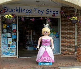 Giant Playmobil princess or queen model outside toy shop