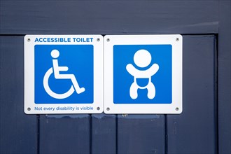 Accessible toilet and baby changing signs on public toilets
