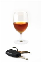 Car key and glass with alcohol