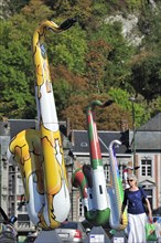 Decorated saxophones on bridge over the river Meuse at Dinant