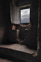 Room with window seat in recess inside medieval Beersel Castle