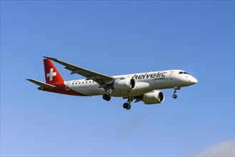 Helvetic Airways passenger aircraft Embraer E190-E2 on approach to Zurich airport