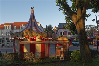 Small children's carousel with ticket office