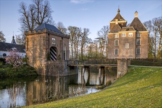 Medieval castle Soelen with gatehouse and bridge over moat at Buren in spring
