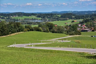 The country road up the Auerberg near Benbeuern in the district of Weilheim-Schongau
