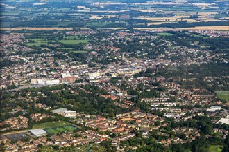 Oblique aerial view through plane window of Bishop's Stortford town