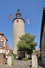 Historic tower with German national flag at the Kurmainzisches Schloss