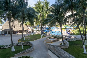 Swimming pools and palm trees at Hotel Casa Maya