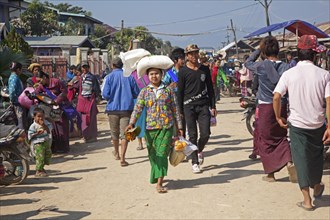 Intha villagers visiting weekly market in lakeside village along Inle Lake