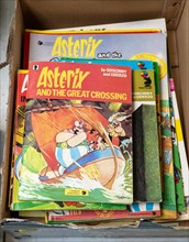 Box of Asterix comic books on display in auction room