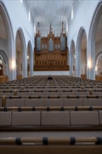 Woman Sitting Alone in St. Johann Reformed Church in Schaffhausen