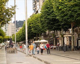 People walking along pedestrianised street Rua Montero