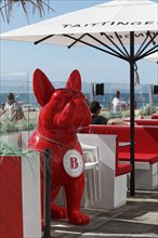 Red bulldog as advertising figure of a restaurant