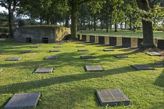 Bunker and graves of fallen German soldiers at the First World War One military cemetery Deutscher Soldatenfriedhof Langemark